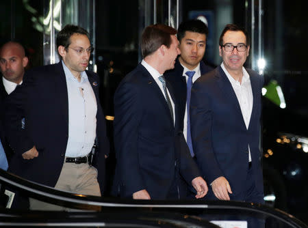 U.S. Treasury Secretary Steven Mnuchin (R), a member of the U.S. trade delegation to China, arrives at a hotel in Beijing, China February 12, 2019. REUTERS/Jason Lee