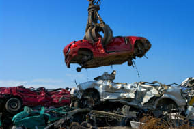 Crane picking up a car in a junkyard.accident, aluminum, car, center, compressed, crane, crushed, destroy, dump, ecology, engine