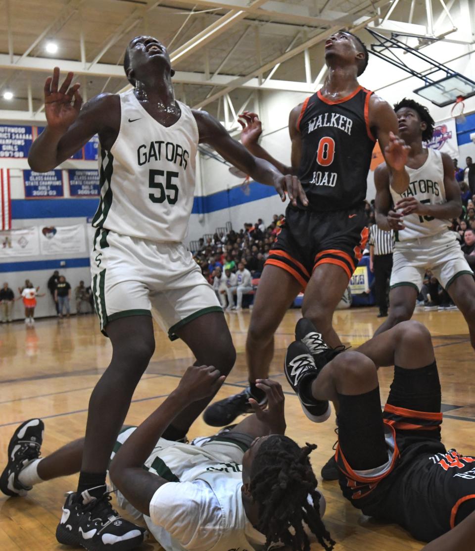 Captain Shreve's Aaron Guinn and Southwood's Jeremiah Evans wait for a rebound in Friday's game at Southwood.