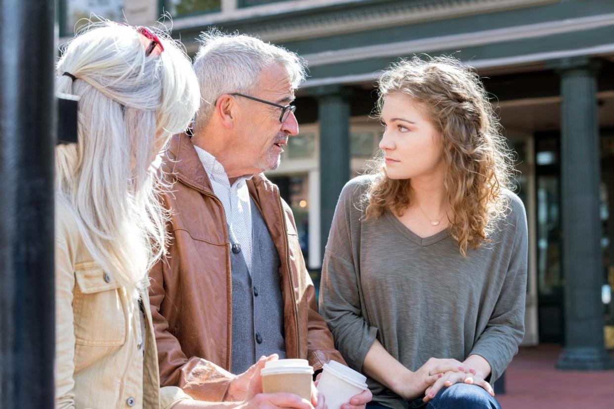 senior couple has serious talk with young relative