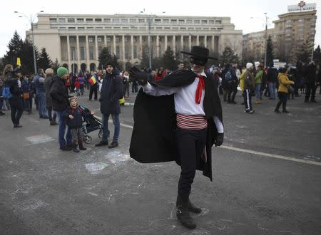 A street artist wearing a 'Zorro' costume is seen during a demonstration against a cabinet decree passed earlier in the week decriminalising some graft offences, in Bucharest, Romania February 4, 2017. REUTERS/Stoyan Nenov