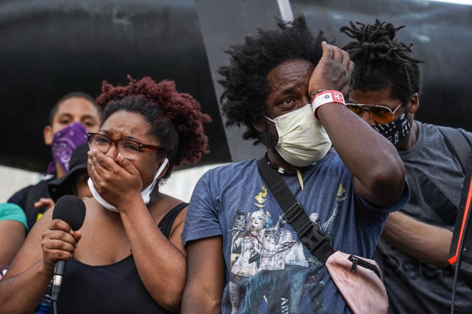 Nakia Renee Wallace and her uncle Tristan Taylor get emotional while talking to protesters at the Monument to Joe Louis in downtown Detroit on the sixth day of protests against police brutality on Wednesday, June 3, 2020.