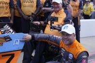 Felix Rosenqvist, of Sweden, reacts after winning the pole for an IndyCar auto race at Indianapolis Motor Speedway, Friday, July 29, 2022, in Indianapolis. (AP Photo/Darron Cummings)