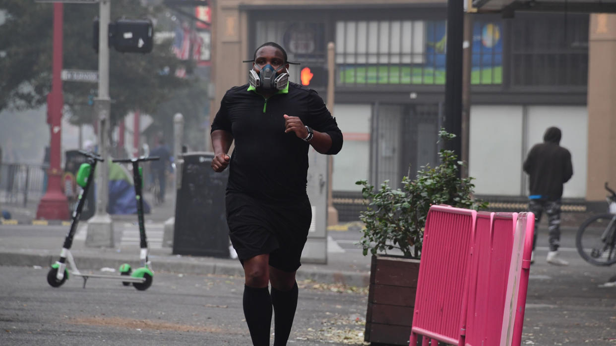 A Portland, Ore., resident wears a respirator 