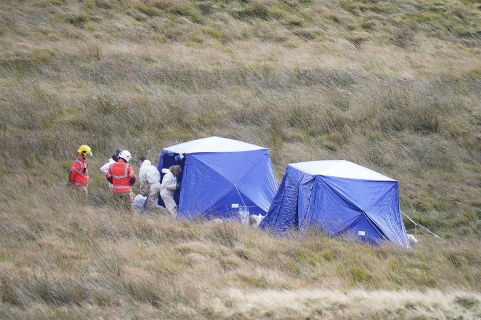 Police officers and firefighters on Saddleworth Moor (PA Wire)