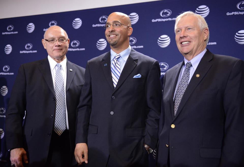 Penn State's new football coach James Franklin, center, poses with athletic director David Joyner, left. and Penn State president Rodney Erickson, right, after being introduced during an NCAA college football news conference on Saturday, Jan. 11, 2014, in State College, Pa. (AP Photo/John Beale)