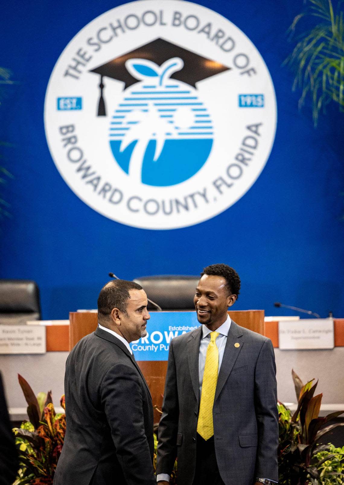 Manuel Nandy Serrano, left, and Torey Alston talk before the swearing-in ceremony for the four new members of the Broward School Board at the Kathleen C. Wright Administration Center in Fort Lauderdale on Aug. 30, 2022. The new board named Alston as the board chair on Tuesday morning.