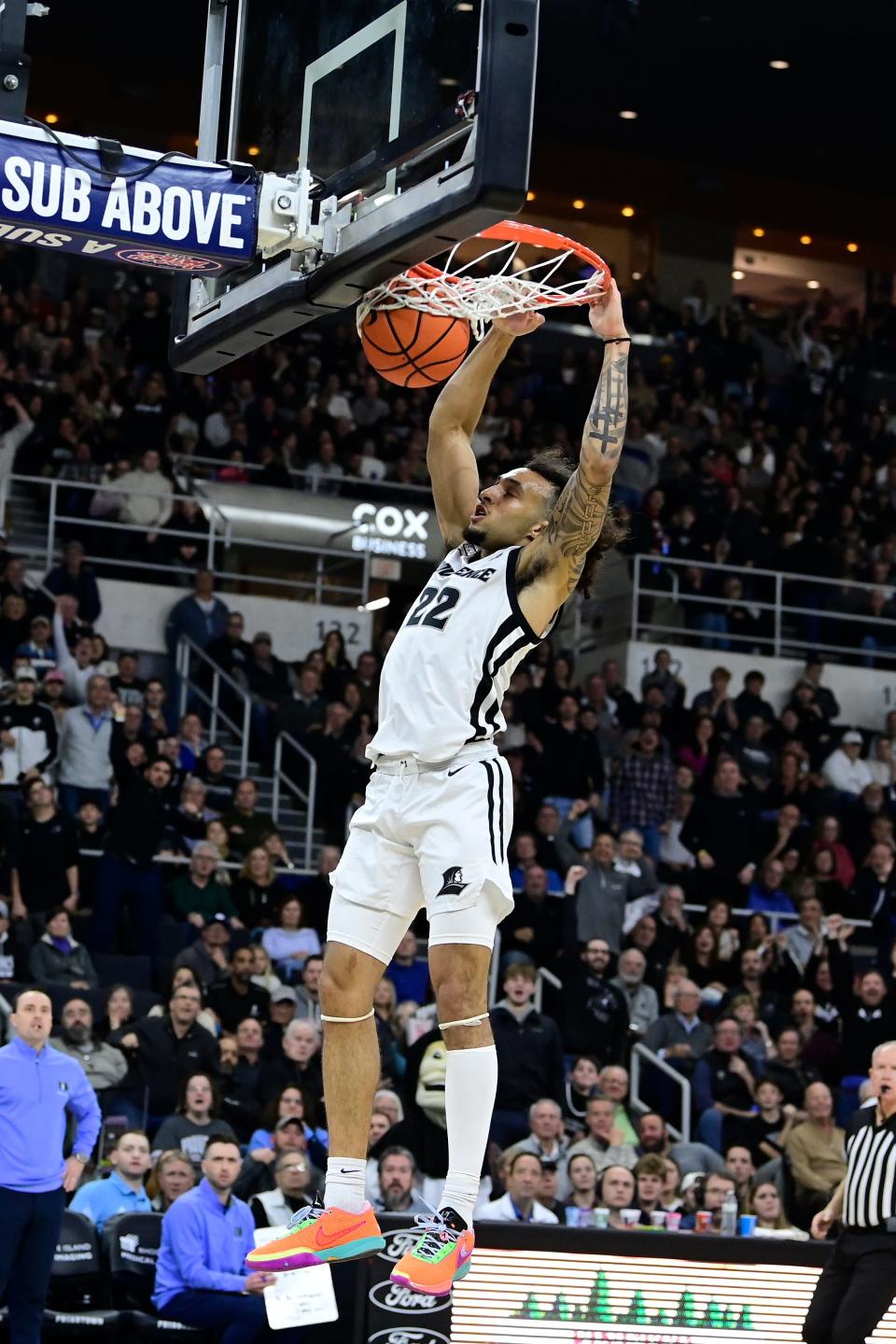 Providence guard Devin Carter (22) dunks the ball against the Rhode Island Rams in a game earlier this month.