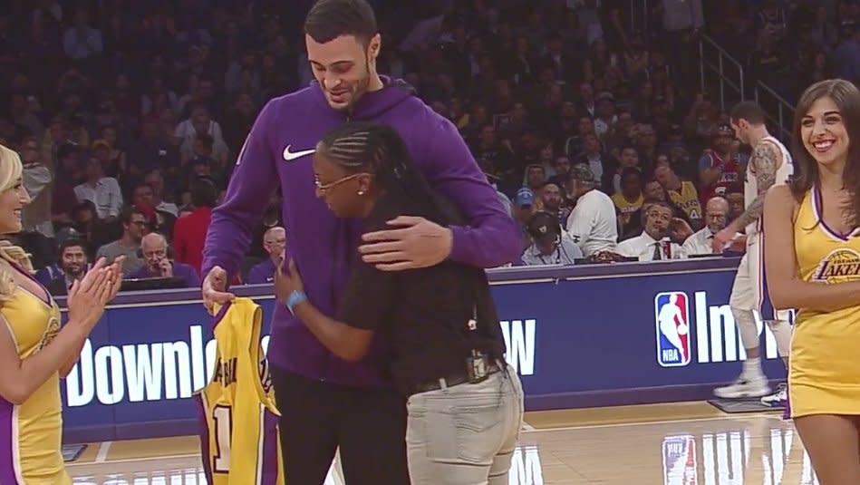 Lakers forward Larry Nance Jr. embraces U.S. Army Specialist Bianca Campbell, his old pen pal. (Screencap via NBA)