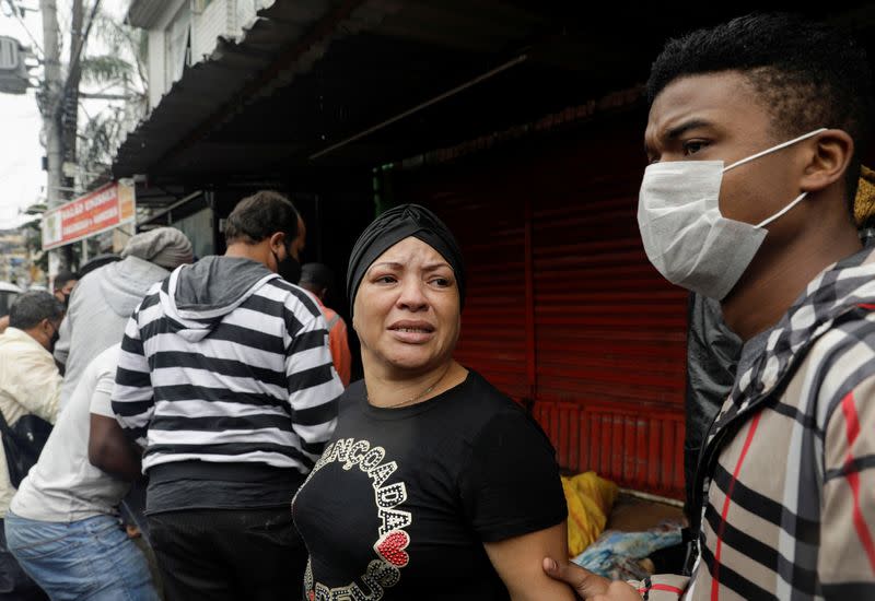 Residents react after a police operation against drug gangs in Rio de Janeiro