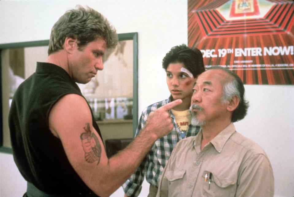 Sensei John Kreese (Martin Kove), left, bullied high school student Daniel LaRusso (Ralph Macchio) and his karate teacher Mr. Miyagi (Pat Morita) in a scene from the 1984 film "The Karate Kid."