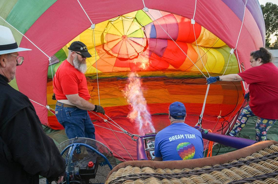Hot air balloon pilots inflate their balloon at the Clovis Rodeo Grounds during a media event on Friday, Sept. 23, 2022 promoting this weekend’s 47th annual ClovisFest and hot air balloon fun fly.