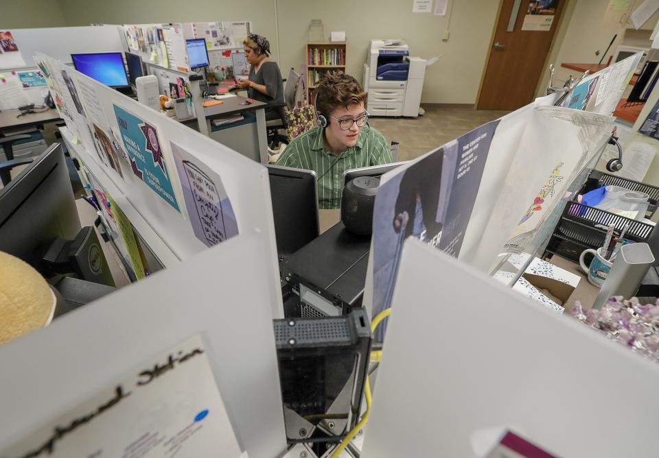 Mars Johnson, a Crisis Response Advocate, fields a call from someone needing assistance at the Center for Women and Families.May 9, 2019