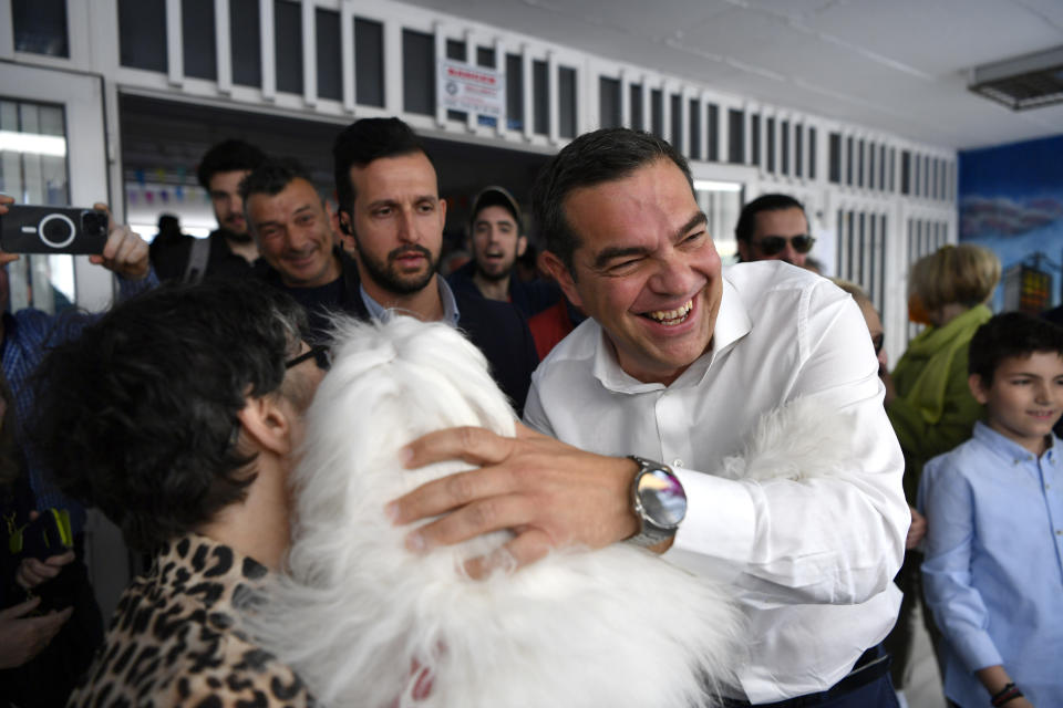 Leader of the main opposition Syriza party, Alexis Tsipras greeting his supporters at a polling station in Athens, Greece, Sunday, May 21, 2023. Polls have opened in Greece's parliamentary election, the first since the country's economy ceased to be subject to strict supervision and control by international lenders who had provided bailout funds during its nearly decade-long financial crisis. (AP Photo/Michael Varaklas)