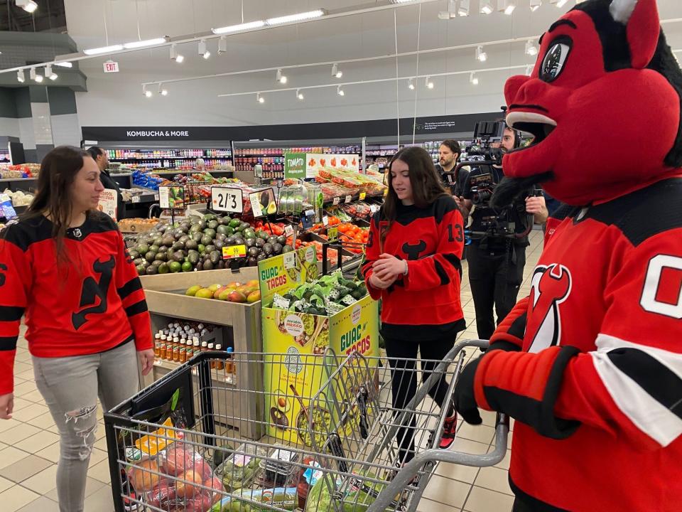 Air Force Senior Master Sgt. Ayshah Tual and her two children with New Jersey Devils Forward Curtis Lazar and the NJ Devils mascot. Tual received a $500 shopping spree at the Clifton Stop & Shop on May 13th for Military Appreciation Month.