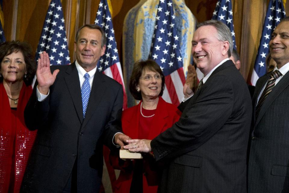 FILE - In this Jan. 3, 2013 file photo, Rep. Steve Stockman, R-Texas, second from right, participates in a mock swearing-in ceremony with Speaker of the House Rep. John Boehner, R-Ohio, for the 113th Congress in Washington. Stockman shocked the political world by filing a last-minute Republican primary challenge Monday, Dec. 9, 2013 against incumbent U.S. Sen. John Cornyn. Cornyn is the Senate's minority whip and had appeared likely to escape a major primary challenge from the tea party or other conservative factions. (AP Photo/ Evan Vucci, File)