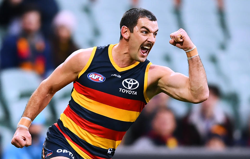 Taylor Walker is seen here celebrating a goal for Adelaide against West Coast. 