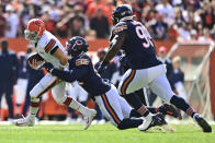 Chicago Bears outside linebacker Khalil Mack, second from left, sacks Cleveland Browns quarterback Baker Mayfield during the first half of an NFL football game, Sunday, Sept. 26, 2021, in Cleveland. (AP Photo/David Dermer)