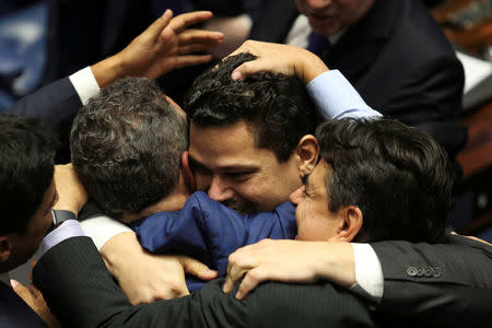 Davi Alcolumbre, from the Democratas party is congratulated by his colleagues after being elected for presidency of Brazilian senate in Brasilia, Brazil February 2, 2019. Fabio Rodrigues Pozzebom/Agencia Brasil/Handout via REUTERS