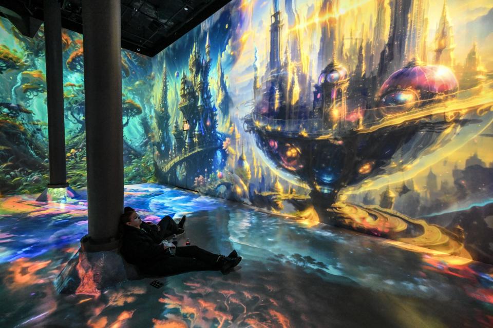 People visit the World of AI·magination exhibition at the Artechouse in New York, United States on February 01, 2024. World of AI·magination is Artechouse Studio's latest venture into the dynamic world of generative AI, resulting in a large-scale experiential digital artwork.