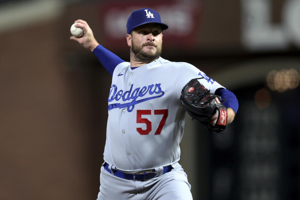 FILE - Los Angeles Dodgers relief pitcher Ryan Brasier throws to a San Francisco Giants batter during the seventh inning of a baseball game in San Francisco, Sept. 29, 2023. The Dodgers have agreed to terms with right-handed pitcher Brasier on a $9 million, two-year contract. (AP Photo/Jed Jacobsohn, File)