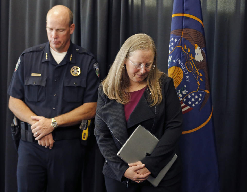 Lori McDonald, University of Utah Associate Vice President and Dean of Students, and University of Utah Police Chief Dale Brophy walk off following a news conference at the University of Utah Tuesday, Oct. 23, 2018, in Salt Lake City. A University of Utah student was shot and killed on campus by a former boyfriend, who was found dead hours later inside a church Tuesday, authorities said. (AP Photo/Rick Bowmer)