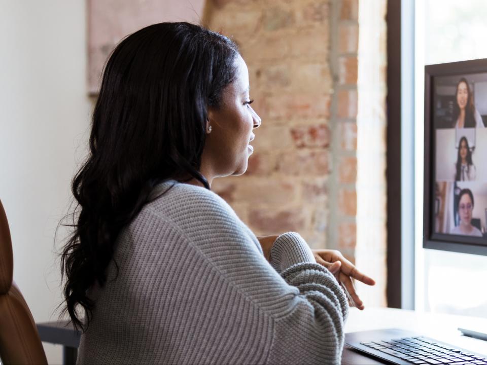 A woman uses video conferencing to chat with colleagues (Getty Images)