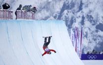 Poland's Michal Ligocki crashes during the men's snowboard halfpipe qualification round at the 2014 Sochi Winter Olympic Games in Rosa Khutor February 11, 2014. REUTERS/Mike Blake (RUSSIA - Tags: OLYMPICS SPORT SNOWBOARDING TPX IMAGES OF THE DAY)