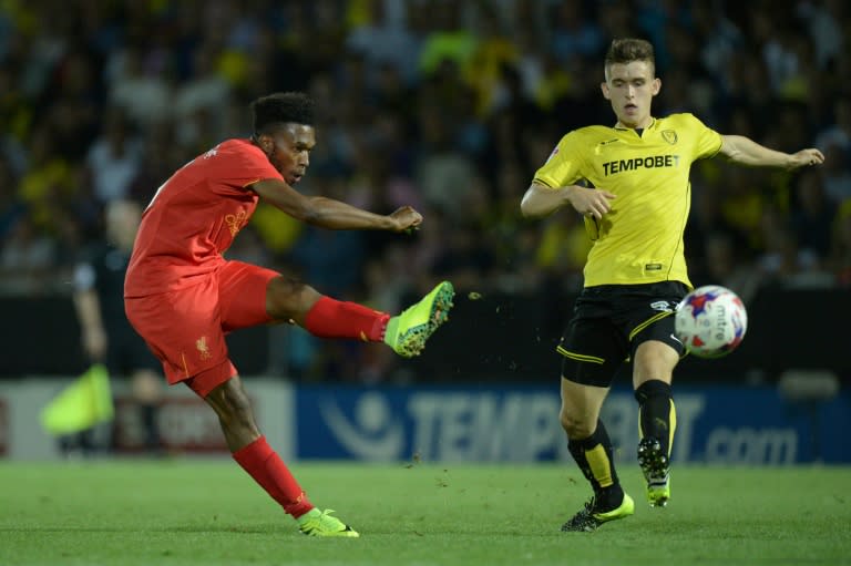 Liverpool's striker Daniel Sturridge (L) shoots but sees his shot saved on August 23, 2016