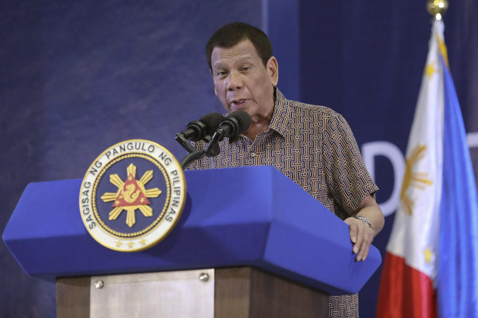 In this Jan. 23, 2020, photo provided by the Malacanang Presidential Photographers Division, Philippine President Rodrigo Duterte delivers his speech at the San Isidro Central School during the distribution of benefits to former rebels in Leyte province, southern Philippines. Duterte has renewed a threat to terminate an accord that allows American forces to train in the country unless Washington restored a visa of a political ally linked to human rights violations. (Karl Norman Alonzo/Malacanang Presidential Photographers Division via AP)