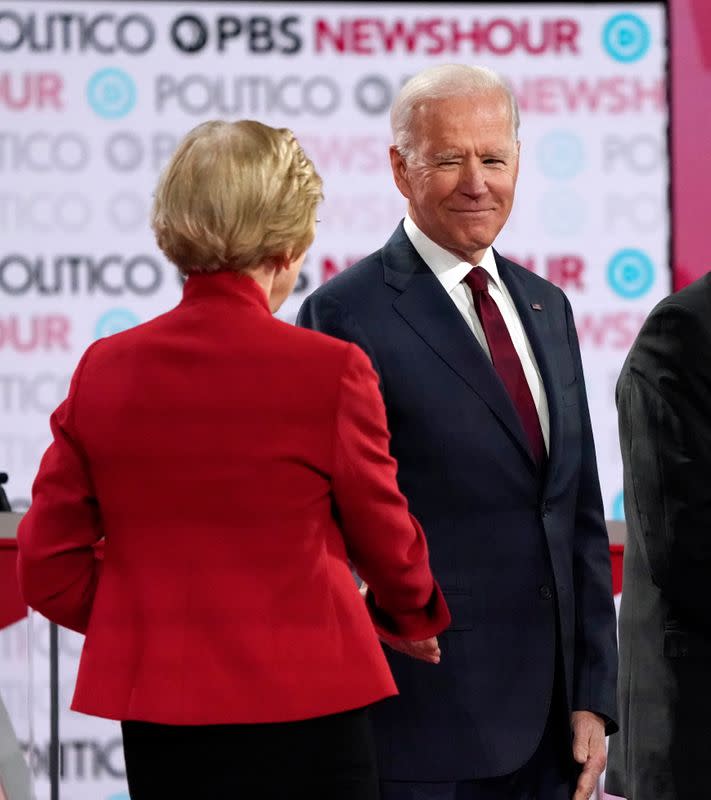 Democratic U.S. presidential candidate and former Vice President Joe Biden greets Senator Elizabeth Warren before the start of the sixth Democratic presidential candidates campaign debate at Loyola Marymount University in Los Angeles