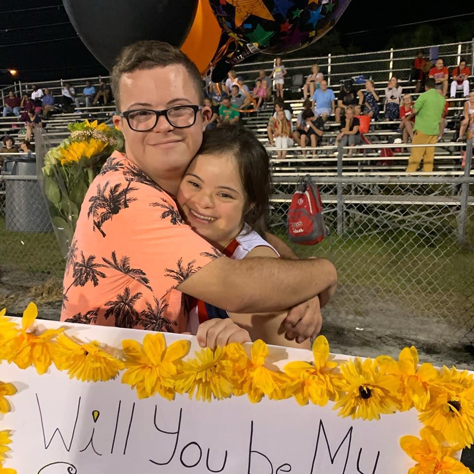 In a viral video, David Matthew Cowan asks his girlfriend, both of whom have Down syndrome, to homecoming at a high school football game. (Credit: Saris Maria Garcia/Facebook)