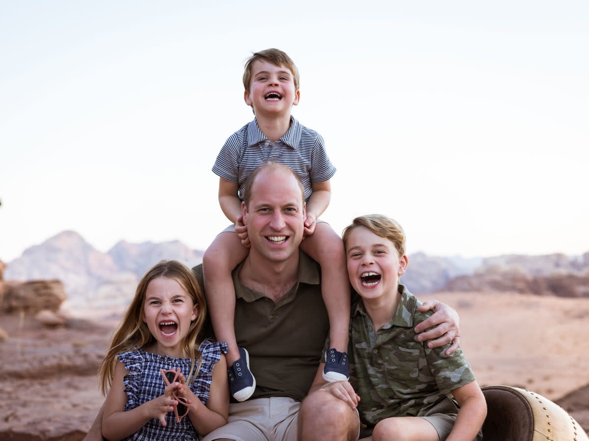 Handout photo issued by Kensington Palace of the Duke of Cambridge with his children, Prince Louis, Prince George (right) and Princess Charlotte, to mark Father’s Day 2022 (PA)