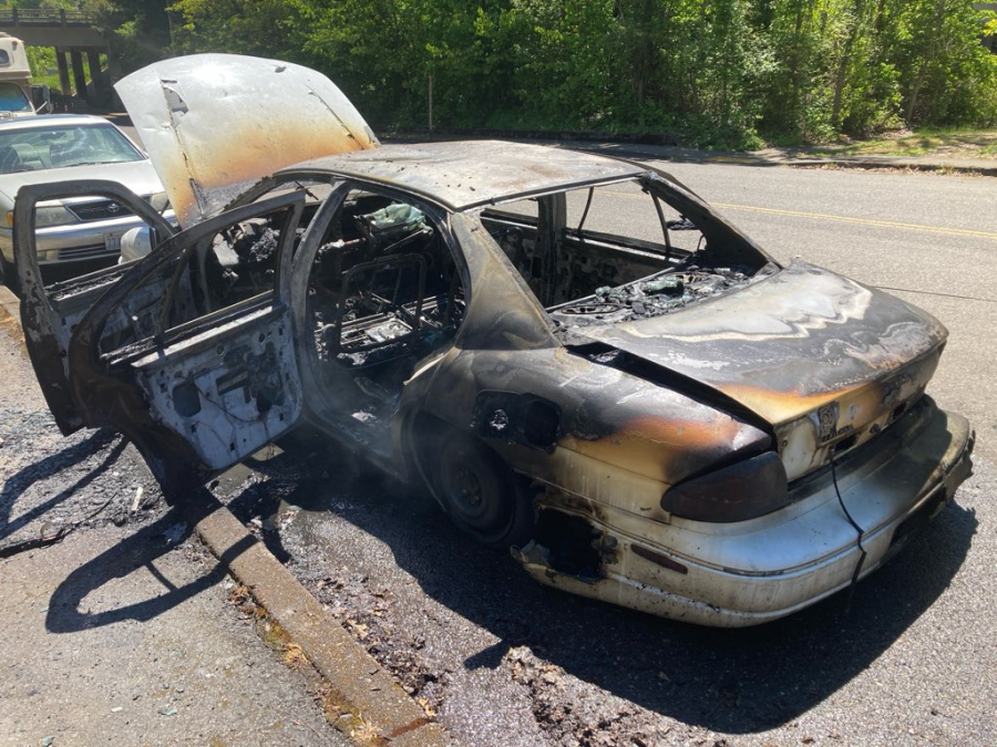 A woman was arrested Thursday after allegedly stabbing two cars and setting one on fire in Southwest Portland. May 9, 2024 (courtesy Portland Police Bureau).