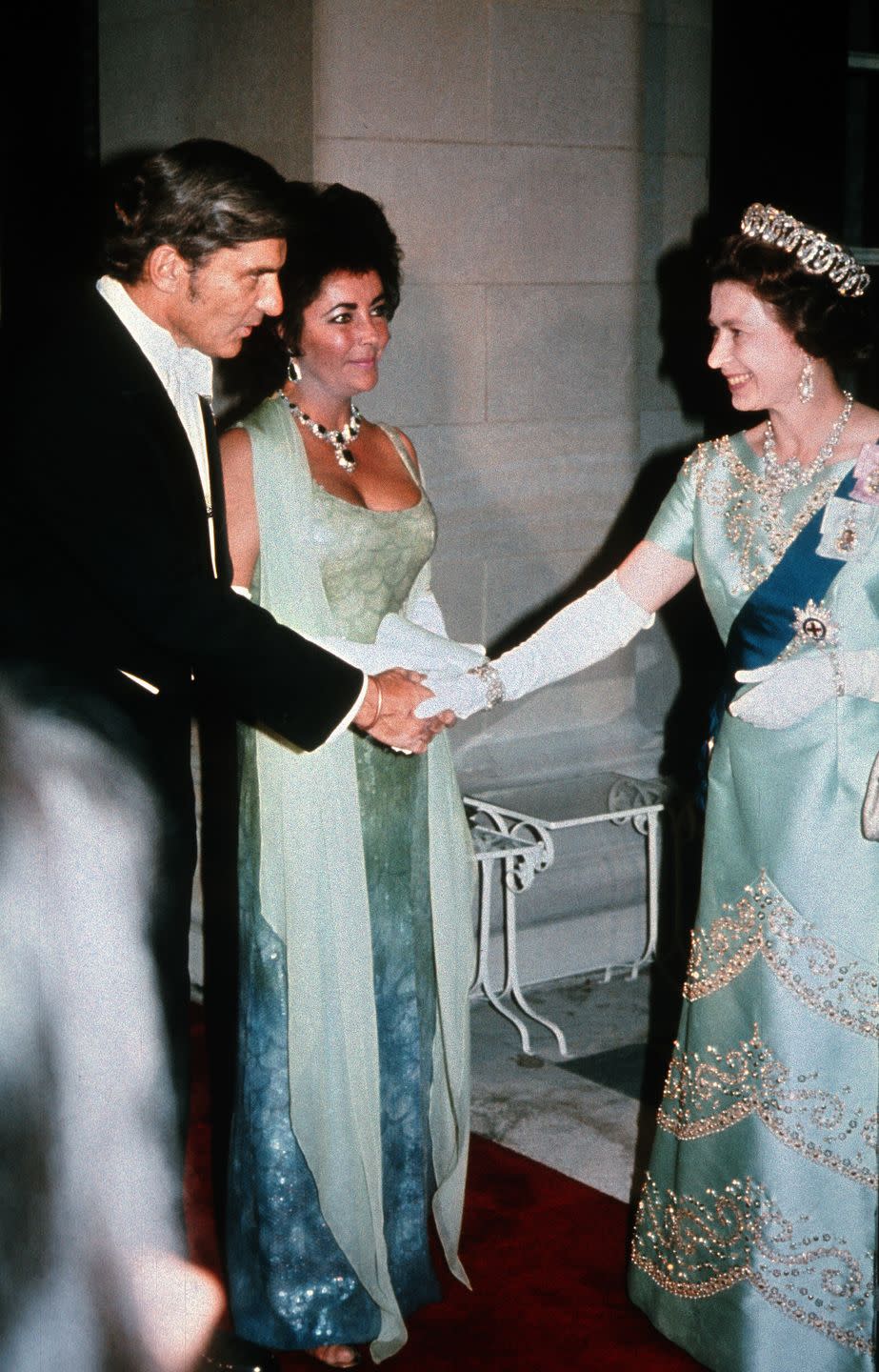 <p>Elizabeth met Elizabeth at a charity gala in 1976. The icons are basically twinning, from their dress colors down to their over-the-top jewelry, and I’m here for it.</p>