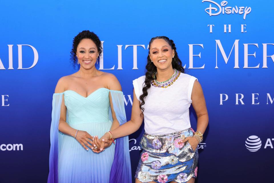 Tamera Mowry-Housley and Tia Mowry attend the world premiere of Disney's 