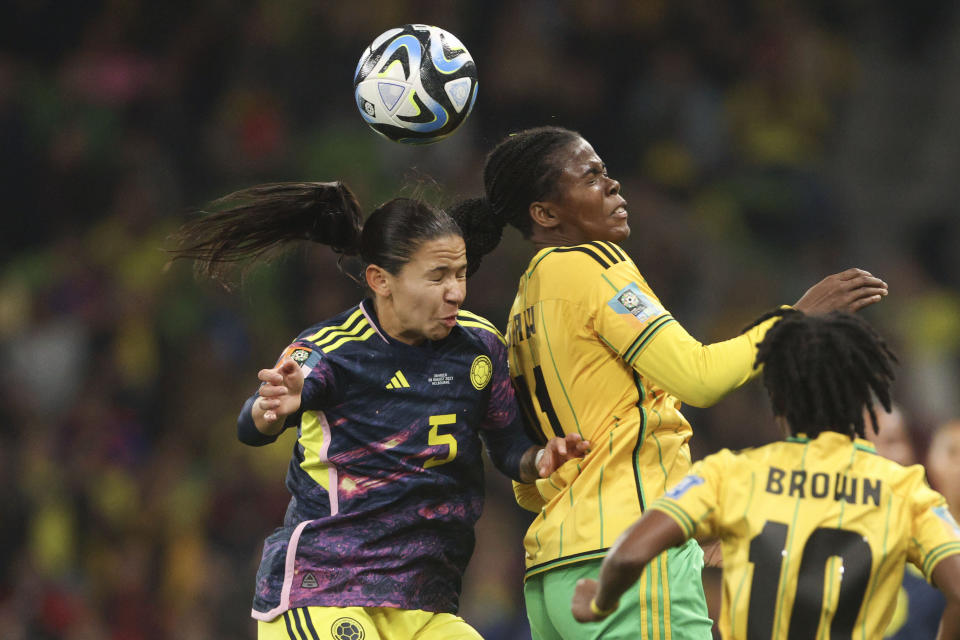 Colombia's Lorena Bedoya Durango, left, and Jamaica's Khadija Shaw go for a header during the Women's World Cup round of 16 soccer match between Jamaica and Colombia in Melbourne, Australia, Tuesday, Aug. 8, 2023. (AP Photo/Hamish Blair)