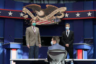 Mock debaters stand onstage as preparations take place for the first Presidential debate in the Sheila and Eric Samson Pavilion, Monday, Sept. 28, 2020, in Cleveland. The first debate between President Donald Trump and Democratic presidential candidate, former Vice President Joe Biden is scheduled to take place Tuesday, Sept. 29. (AP Photo/Patrick Semansky)