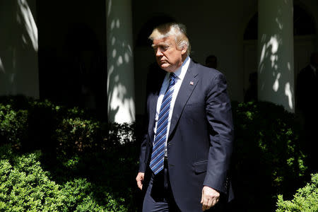 U.S. President Donald Trump arrives to present the U.S. Air Force Academy football team with the Commander-in-Chief trophy in the Rose Garden of the White House in Washington, U.S., May 2, 2017. REUTERS/Joshua Roberts