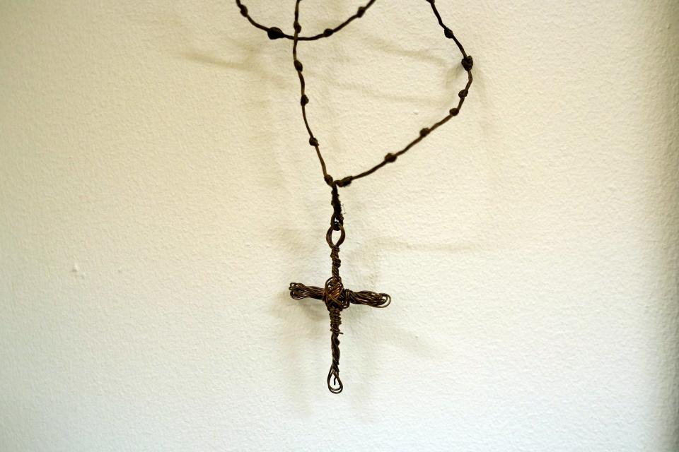 A rosary made by jailed opposition leader Leopoldo Lopez is exhibited on the ground floor of a small old building, in Caracas, Venezuela, on Friday, Dec. 21, 2018. Inspired by Chile's Museum of Remembrance, opponents of the Nicolas Maduro government have created a similar place in the small old building to remember the several hundred political prisoners who have died in anti-government protests in recent years. (AP Photo/Fernando Llano)