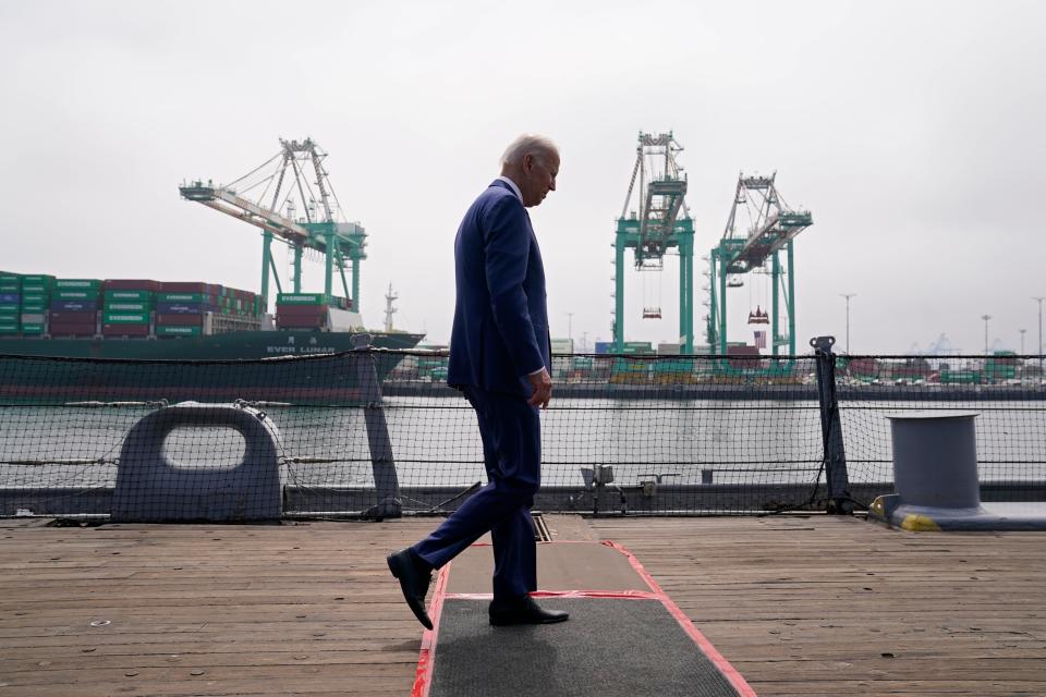 President Joe Biden walks across the deck of the USS Iowa battleship after speaking about inflation and supply chain issues at the Port of Los Angeles on Friday.