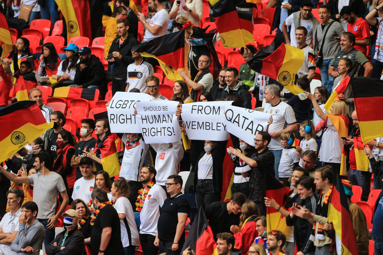 LONDON, ENGLAND - JUNE 29: German fans hold up protest signs reading LGBTQ Rights Should Be Human Rights From Wembley To Qatar ahead of the UEFA Euro 2020 Championship Round of 16 match between England and Germany at Wembley Stadium on June 29, 2021 in London, United Kingdom. (Photo by Simon Stacpoole/Offside/Offside via Getty Images)