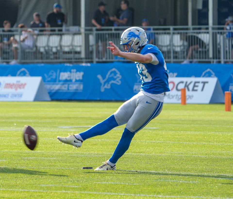 K Jake Bates practices his kicks while P Jack Fox looks on during the Detroit Lions training camp at their headquarters in Allen Park, Mich. on Thursday, Aug. 1, 2024.