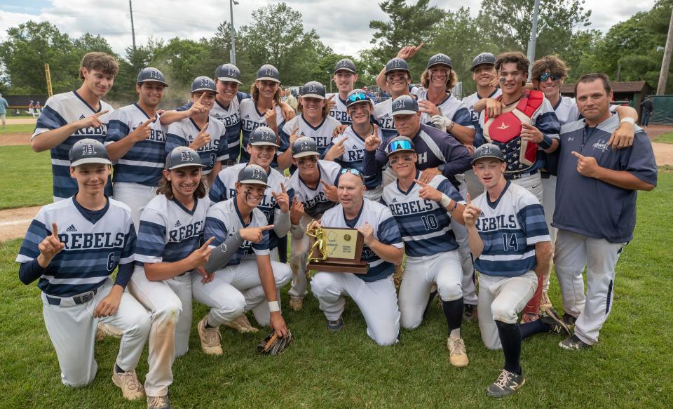 Howell poses with the NJSIAA Group 4 championship plaque after it defeated Hunterdon Central 9-8 Saturday in the NJSIAA Group 4 championship game. .