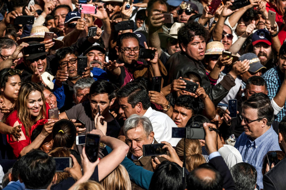 Mexican President Andres Manuel Lopez Obrador (C below) greets people as he arrives to a rally to 'defend mexican dignity' in Tijuana, Baja California state, on June 8, 2019, Mexico. (Photo by Guillermo Arias / AFP)        (Photo credit should read GUILLERMO ARIAS/AFP/Getty Images)