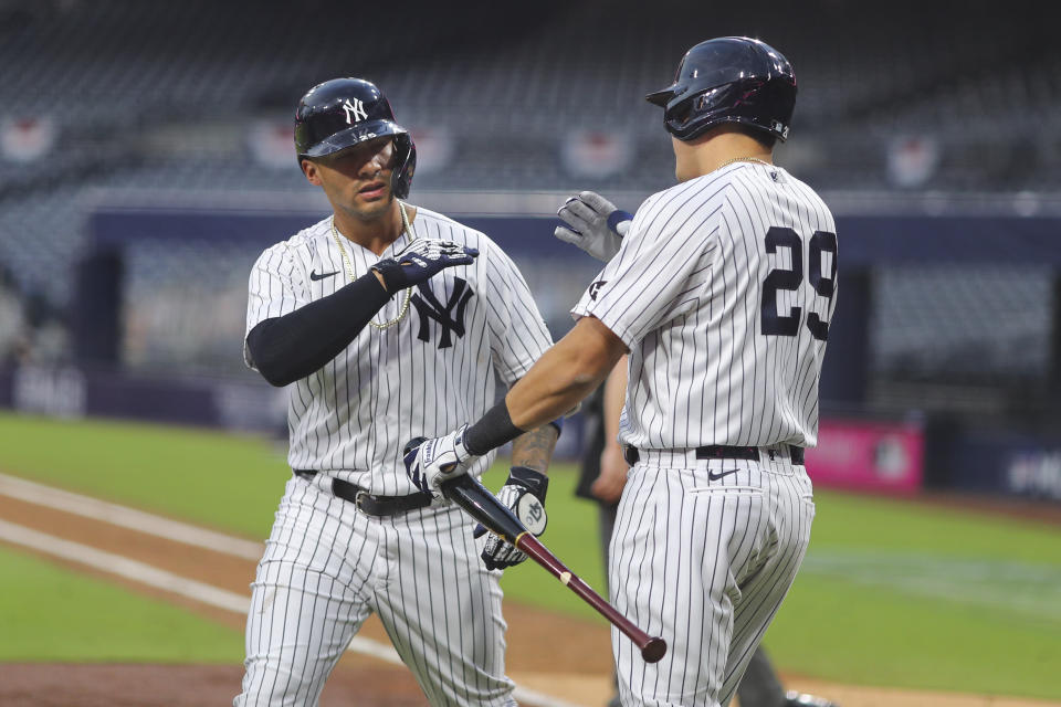 Gleyber Torres of the New York Yankees celebrates with Gio Urshela after hitting a two-run home run in the sixth inning during Game 4 of the ALDS. (Photo by Alex Trautwig/MLB Photos via Getty Images)