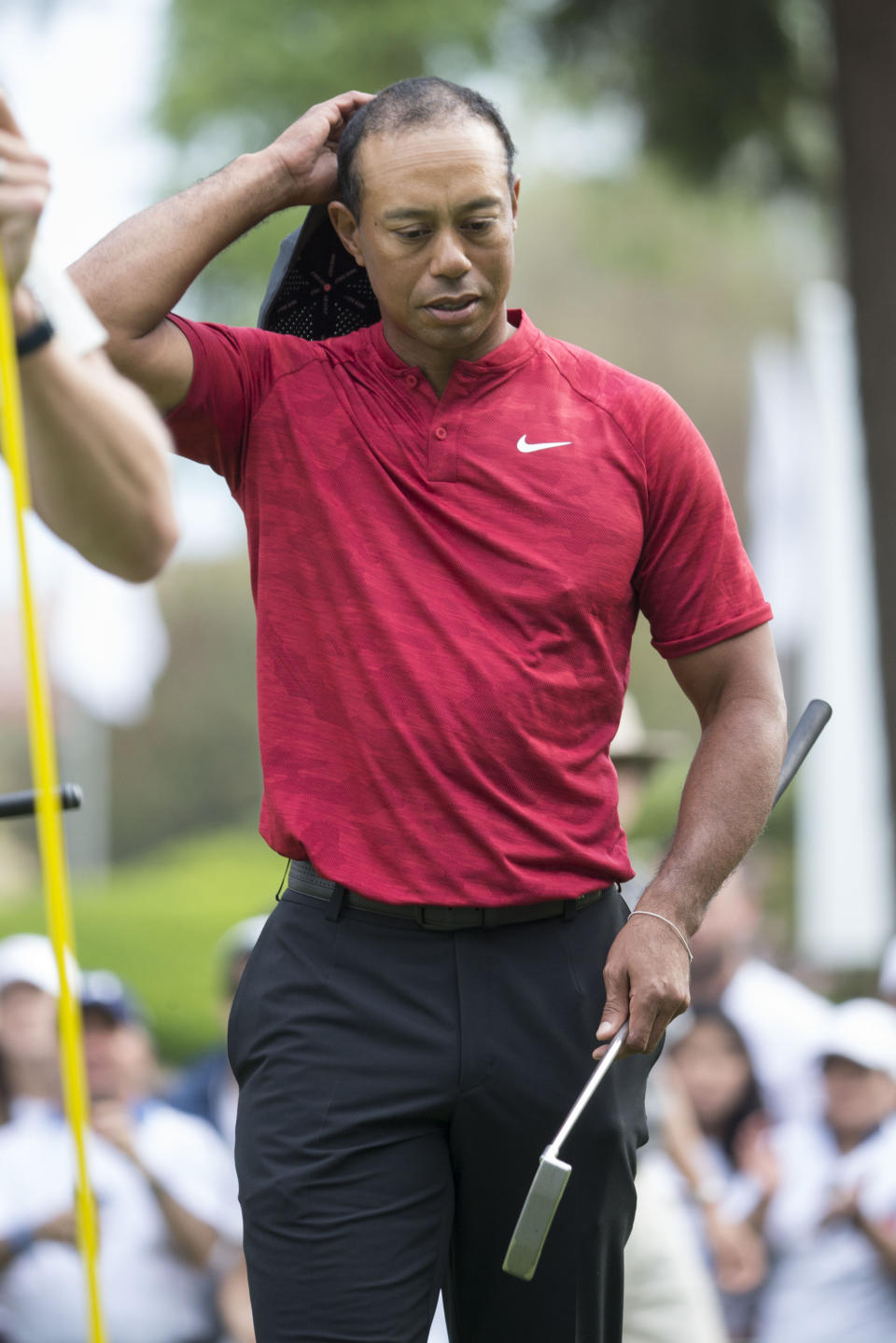 U.S. golfer Tiger Woods adjusts his hat at the end of the Mexico Championship at Chapultepec Golf Club in Mexico City, Sunday, Feb. 24, 2019. Woods got his first top 10 of the year at the tournament. (AP Photo/Christian Palma)