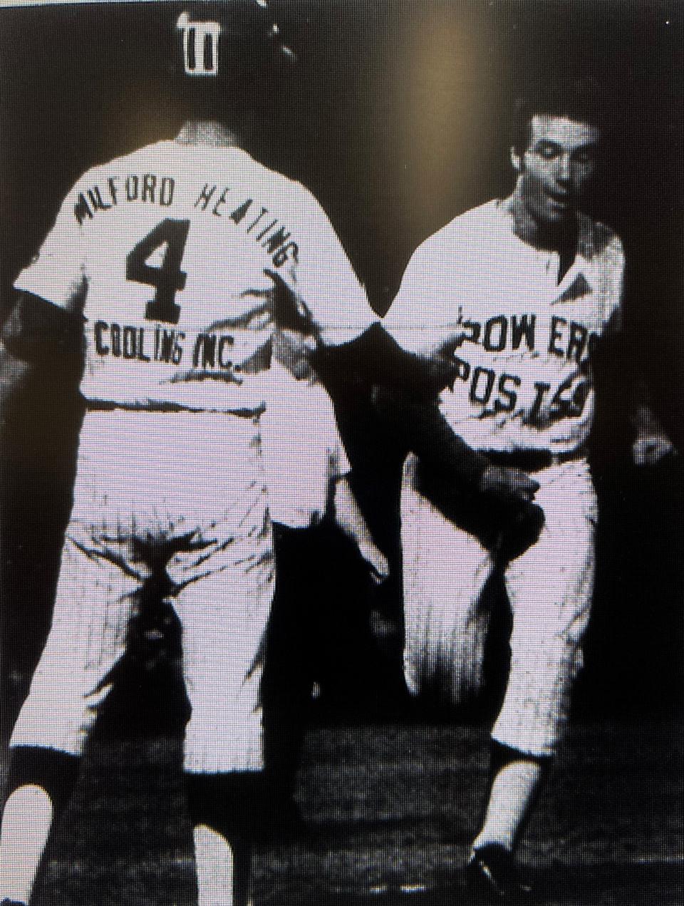 Bob Protano crosses the plate and is greeted by Post 59 teammate Buddy Sayles during the 1972 season.