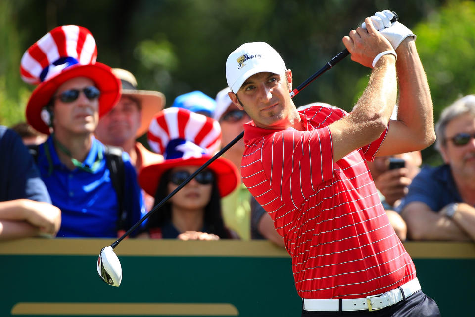 MELBOURNE, AUSTRALIA - NOVEMBER 18: Dustin Johnson of the U.S. Team hits his tee shot on the second hole during the Day Two Four-Ball Matches of the 2011 Presidents Cup at Royal Melbourne Golf Course on November 18, 2011 in Melbourne, Australia. (Photo by Scott Halleran/Getty Images)