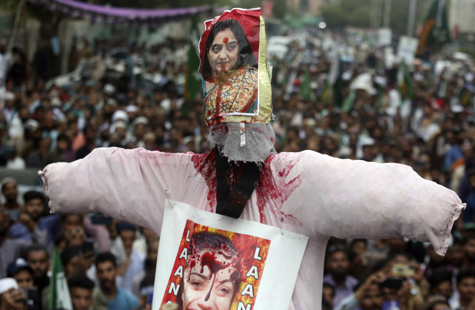An effigy depicting former Bharatiya Janata Party spokeswoman Nupur Sharma is displayed during a demonstration condemning derogatory references to Islam and the Prophet Muhammad recently made by Sharma, a spokesperson of the governing Indian Hindu nationalist party, Friday, June 10, 2022, in Karachi, Pakistan. (AP Photo/Fareed Khan)